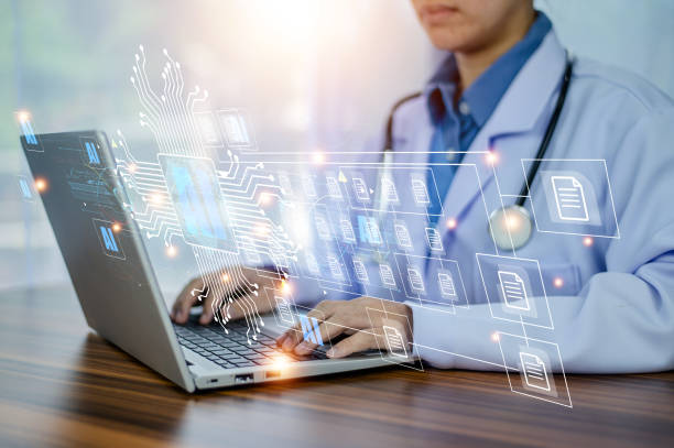 A medical professional using a laptop to access medical credentialing services