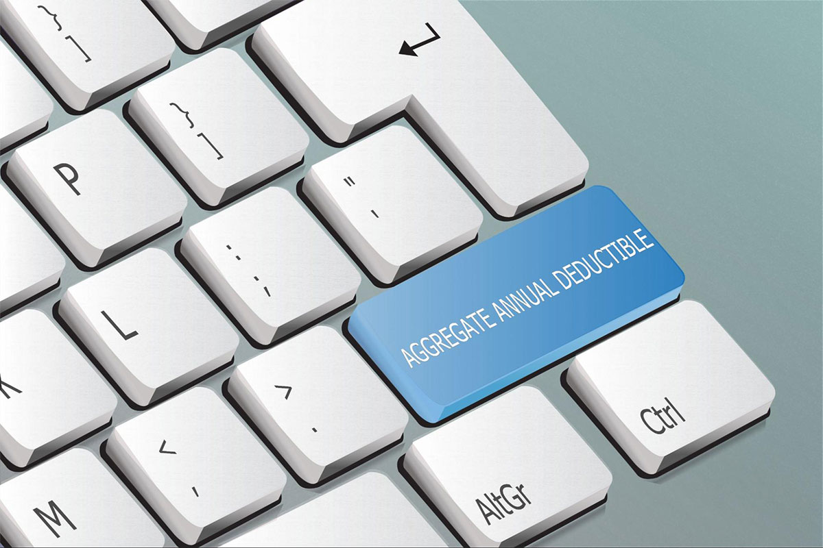 Aggregate annual deductible on a keyboard.