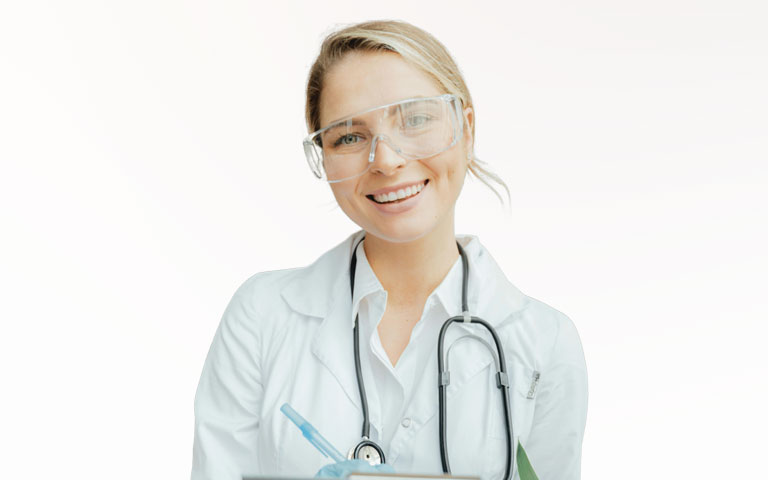 A smiling woman wearing scrubs and providing provider enrollment services